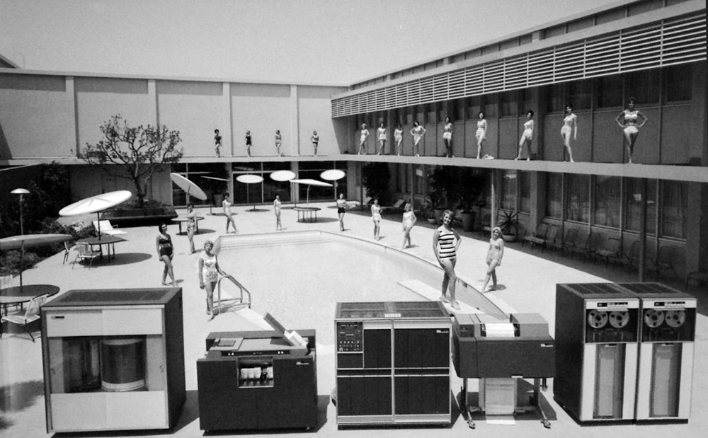 IBM mainframe courtyard scene with women positioned around the pool and balcony